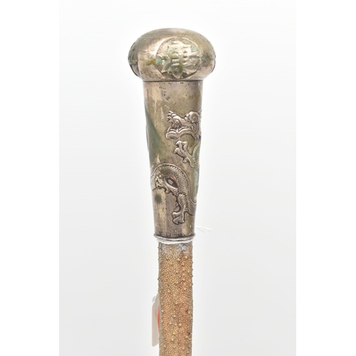 110 - A LATE 19TH CENTURY STINGRAY TAIL WALKING CANE WITH CHINESE WHITE METAL MOUNT, the mount engraved wi... 