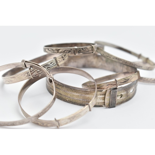 84 - A SELECTION OF MAINLY CHILD'S SILVER AND WHITE METAL BANGLES, to include eight expandable child's ba... 