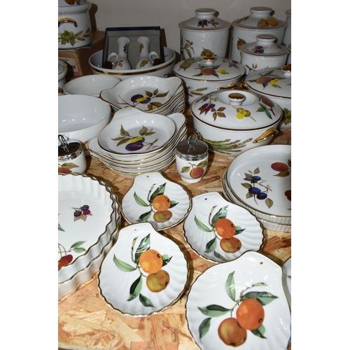 323 - A LARGE QUANTITY OF ROYAL WORCESTER 'EVESHAM' PATTERN DINNERWARE, comprising a 'Pot Du Creme' (handl... 