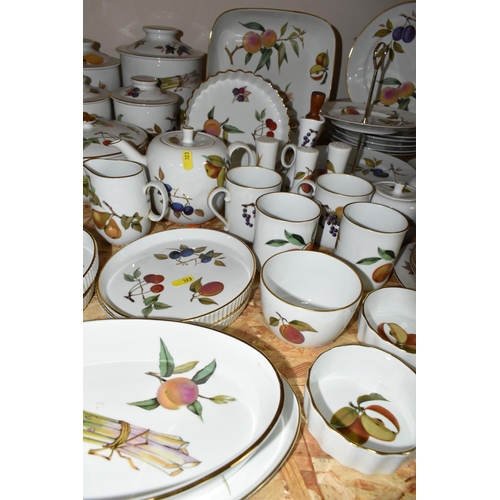 323 - A LARGE QUANTITY OF ROYAL WORCESTER 'EVESHAM' PATTERN DINNERWARE, comprising a 'Pot Du Creme' (handl... 