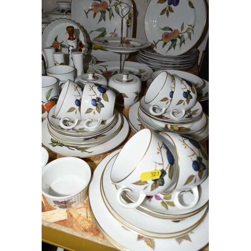 323 - A LARGE QUANTITY OF ROYAL WORCESTER 'EVESHAM' PATTERN DINNERWARE, comprising a 'Pot Du Creme' (handl... 