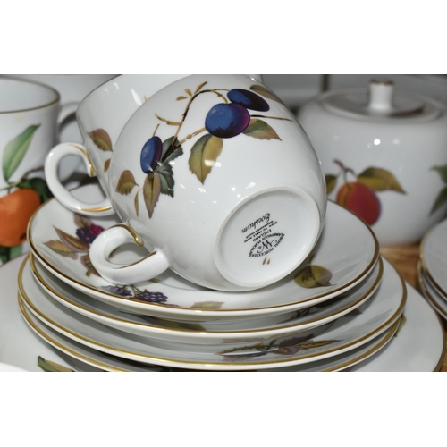 323 - A LARGE QUANTITY OF ROYAL WORCESTER 'EVESHAM' PATTERN DINNERWARE, comprising a 'Pot Du Creme' (handl... 