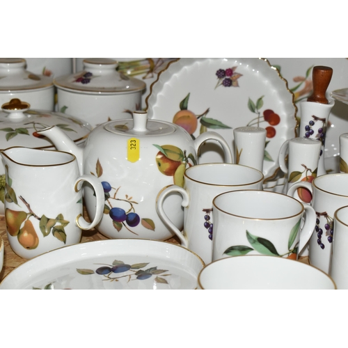 323 - A LARGE QUANTITY OF ROYAL WORCESTER 'EVESHAM' PATTERN DINNERWARE, comprising a 'Pot Du Creme' (handl... 