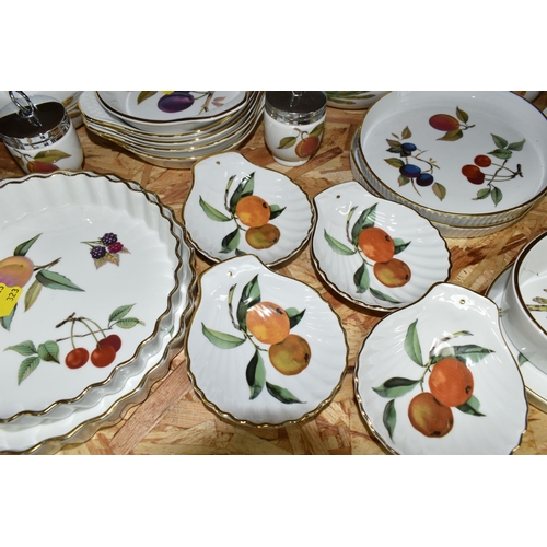 323 - A LARGE QUANTITY OF ROYAL WORCESTER 'EVESHAM' PATTERN DINNERWARE, comprising a 'Pot Du Creme' (handl... 