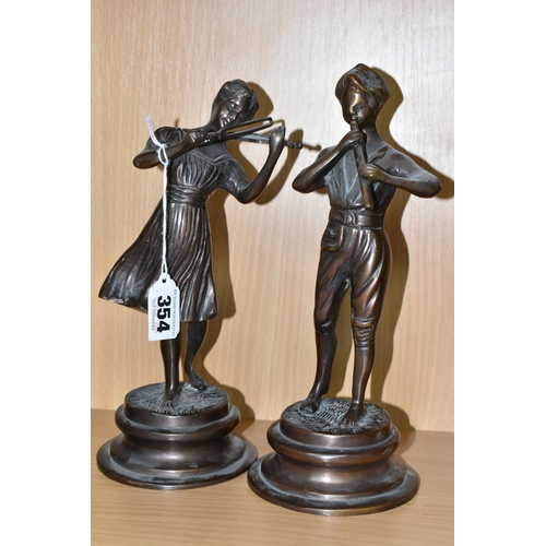 354 - A PAIR OF CAST BRONZED METAL MUSICIAN FIGURES, comprising a female playing a violin and a male playi... 