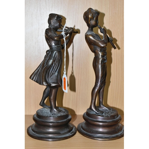 354 - A PAIR OF CAST BRONZED METAL MUSICIAN FIGURES, comprising a female playing a violin and a male playi... 