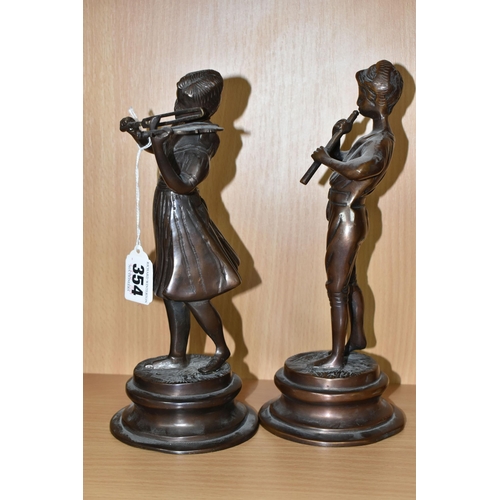 354 - A PAIR OF CAST BRONZED METAL MUSICIAN FIGURES, comprising a female playing a violin and a male playi... 