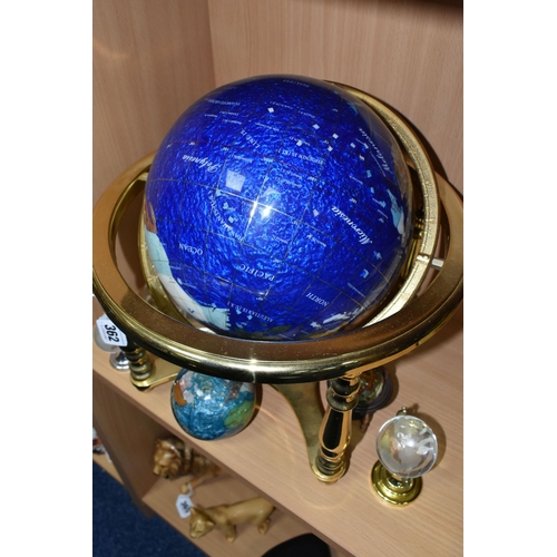 362 - A BLUE LAPIS GEMSTONE TABLE GLOBE, each continent of the globe is inlaid with various semi-precious ... 