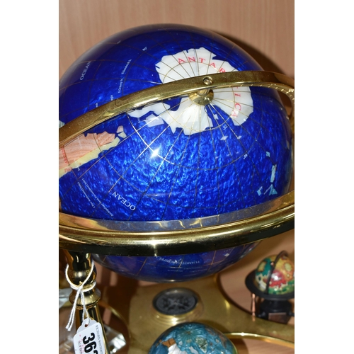 362 - A BLUE LAPIS GEMSTONE TABLE GLOBE, each continent of the globe is inlaid with various semi-precious ... 