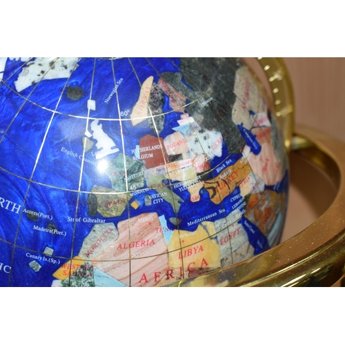 362 - A BLUE LAPIS GEMSTONE TABLE GLOBE, each continent of the globe is inlaid with various semi-precious ... 