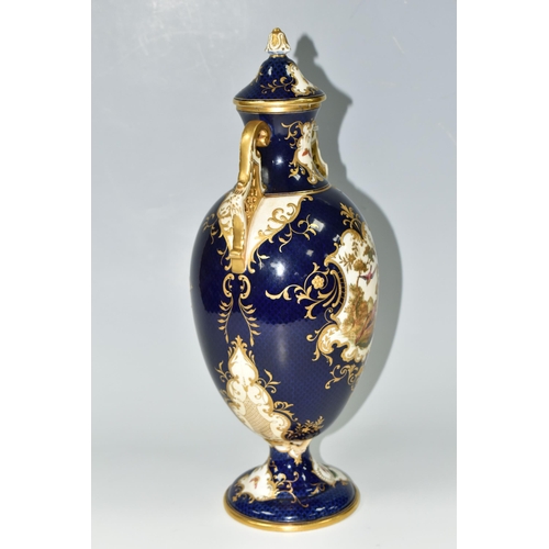 367 - A COALPORT COVERED PEDESTAL VASE, with pierced twin handles, a cobalt blue patterned ground with rai... 