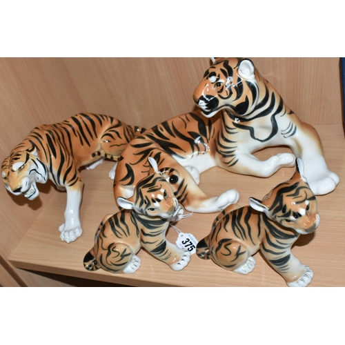 375 - A GROUP OF LOMONOSOV TIGERS, comprising a large recumbent tiger, height 17cm x length 30cm (remnants... 