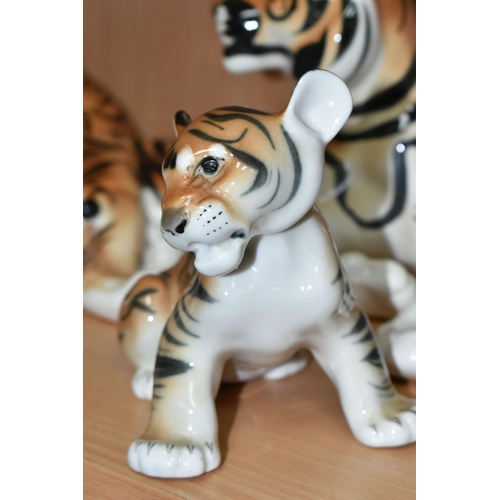 375 - A GROUP OF LOMONOSOV TIGERS, comprising a large recumbent tiger, height 17cm x length 30cm (remnants... 