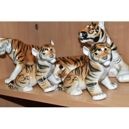 375 - A GROUP OF LOMONOSOV TIGERS, comprising a large recumbent tiger, height 17cm x length 30cm (remnants... 