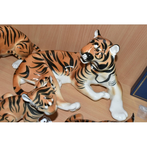 375 - A GROUP OF LOMONOSOV TIGERS, comprising a large recumbent tiger, height 17cm x length 30cm (remnants... 