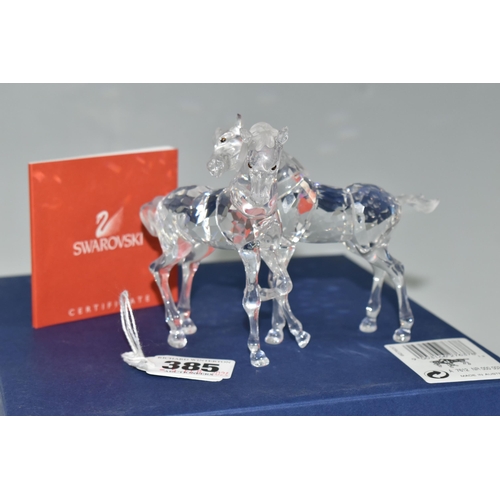 385 - A BOXED SWAROVSKI CRYSTAL 'FOALS - CLEAR' SCULPTURE, depicting two foals playing, model no 627637, f... 