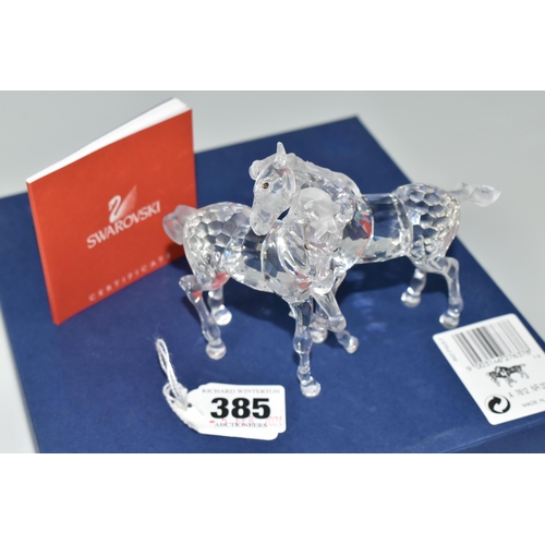 385 - A BOXED SWAROVSKI CRYSTAL 'FOALS - CLEAR' SCULPTURE, depicting two foals playing, model no 627637, f... 