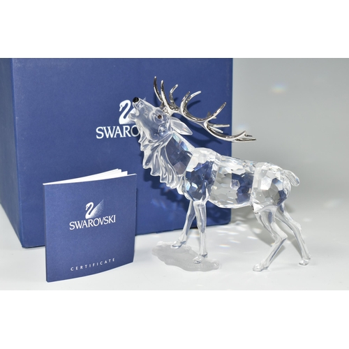 387 - A BOXED SWAROVSKI CRYSTAL 'STAG' SCULPTURE, depicting a stag with metal antlers, model no 291431, fr... 