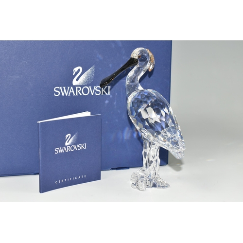 388 - A BOXED SWAROVSKI CRYSTAL 'SPOONBILL' SCULPTURE, depicting a Spoonbill with coloured beak standing a... 