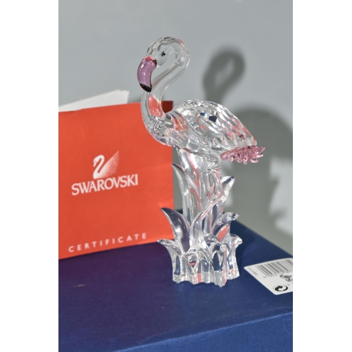 389 - A BOXED SWAROVSKI CRYSTAL 'FLAMINGO' SCULPTURE, depicting a Flamingo with pink beak and tail feather... 