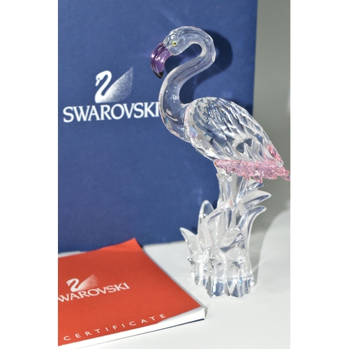 389 - A BOXED SWAROVSKI CRYSTAL 'FLAMINGO' SCULPTURE, depicting a Flamingo with pink beak and tail feather... 