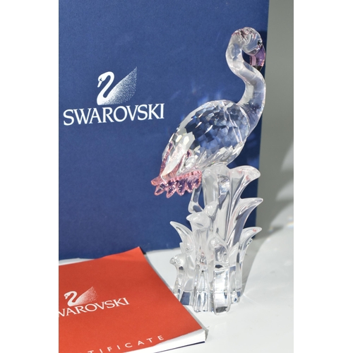 389 - A BOXED SWAROVSKI CRYSTAL 'FLAMINGO' SCULPTURE, depicting a Flamingo with pink beak and tail feather... 