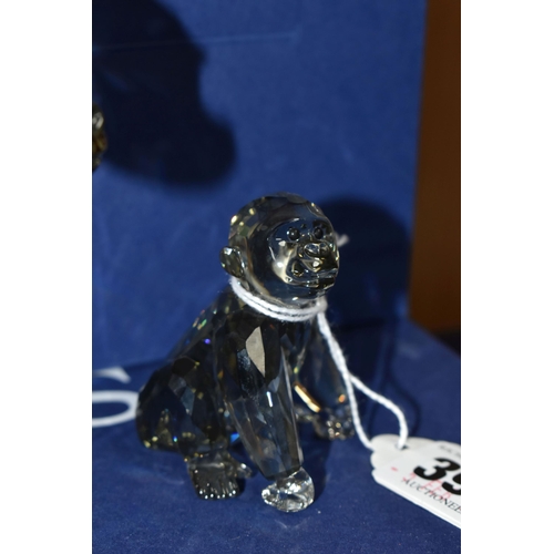 399 - THREE BOXED SWAROVSKI CRYSTAL 2009 ANNUAL EDITION GORILLA SCULPTURES, from the Endangered Wildlife t... 