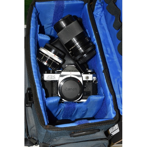 453 - A CAMERA BAG CONTAINING A CANON CAMERA AND SELECTION OF LENSES, comprising a Canon AE-1 program came... 