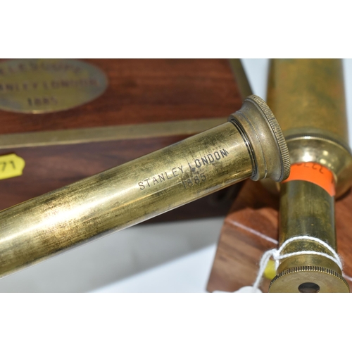 471 - TWO CASED BRASS NAUTICAL TELESCOPES, comprising a brass 'Stanley' three draw telescope stamped Stanl... 