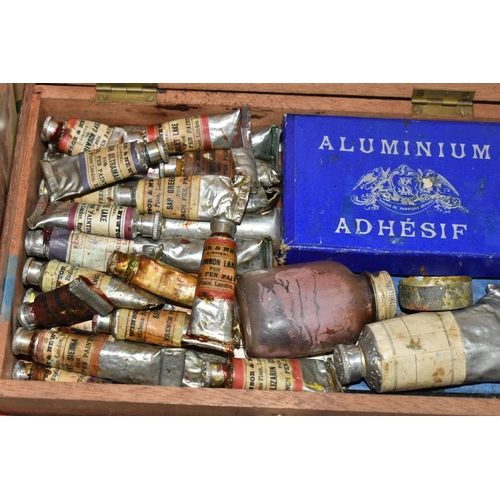 488 - A BOX OF VINTAGE ART MATERIALS, to include a Reeves tin watercolour box, with half pans, tubes, brus... 