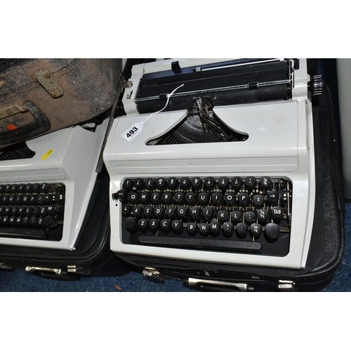 493 - FIVE ROBOTRON 'ERIKA' TYPEWRITERS, mechanical model No.105 made in GDR, with carry cases (5 + 5 case... 