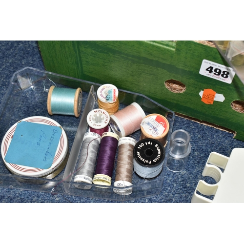 498 - A BOX AND LOOSE SEWING MACHINE AND HABERDASHERY ITEMS, to include a cased Singer electric sewing mac... 