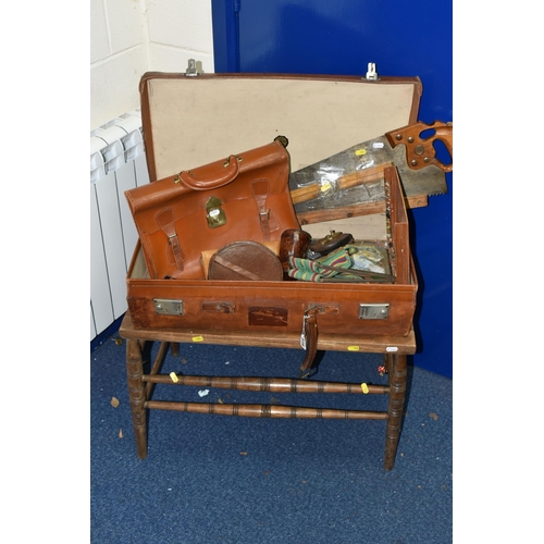 516 - A VINTAGE BROWN LEATHER SUITCASE, made by Finnegans Ltd. of London, containing a vintage carpenter's... 