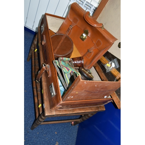 516 - A VINTAGE BROWN LEATHER SUITCASE, made by Finnegans Ltd. of London, containing a vintage carpenter's... 