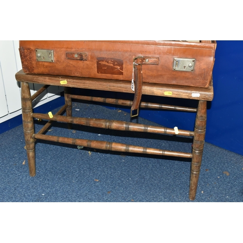 516 - A VINTAGE BROWN LEATHER SUITCASE, made by Finnegans Ltd. of London, containing a vintage carpenter's... 