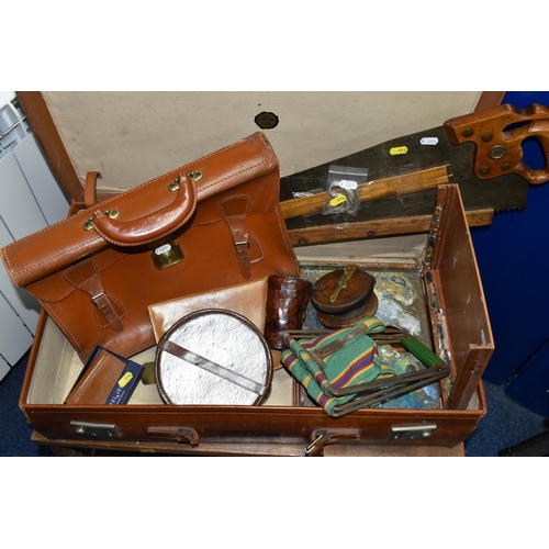 516 - A VINTAGE BROWN LEATHER SUITCASE, made by Finnegans Ltd. of London, containing a vintage carpenter's... 