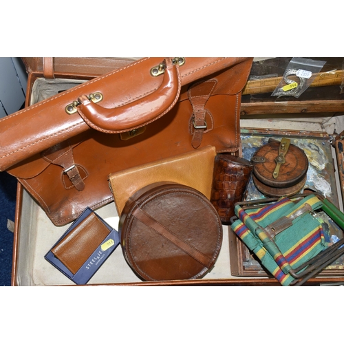 516 - A VINTAGE BROWN LEATHER SUITCASE, made by Finnegans Ltd. of London, containing a vintage carpenter's... 