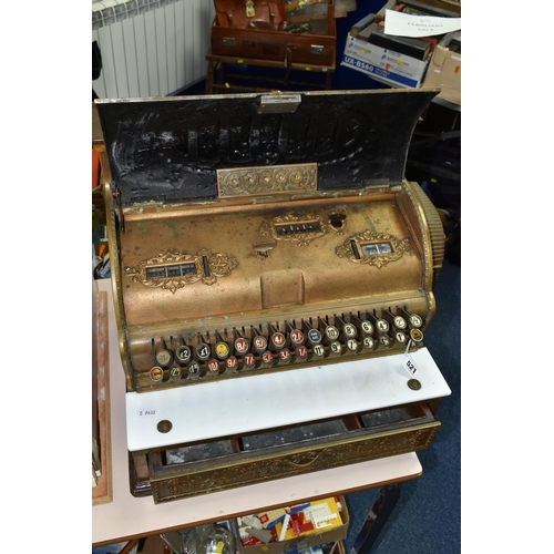 521 - A LATE 19TH CENTURY NATIONAL CASH REGISTER BRASS TILL, serial no.298179, with till roll container, m... 