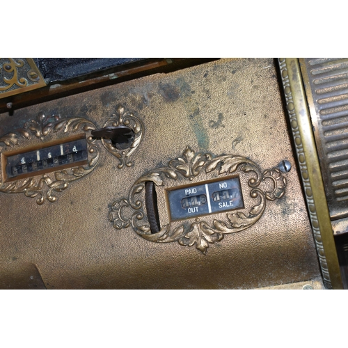 521 - A LATE 19TH CENTURY NATIONAL CASH REGISTER BRASS TILL, serial no.298179, with till roll container, m... 