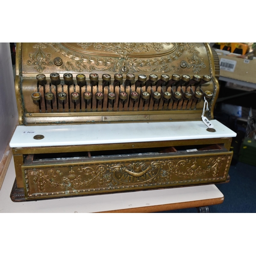 521 - A LATE 19TH CENTURY NATIONAL CASH REGISTER BRASS TILL, serial no.298179, with till roll container, m... 