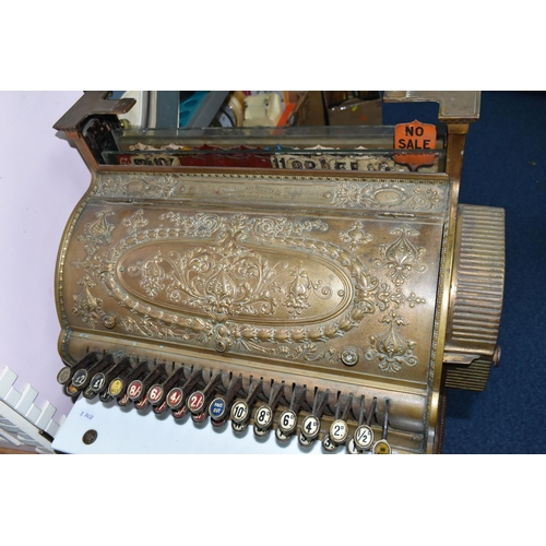 521 - A LATE 19TH CENTURY NATIONAL CASH REGISTER BRASS TILL, serial no.298179, with till roll container, m... 