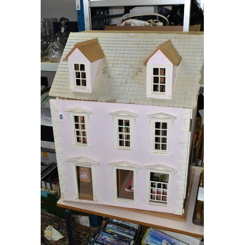 522 - A MODERN WOODEN DOLLS HOUSE, modelled as a two storey villa, front opens to reveal two rooms over tw... 