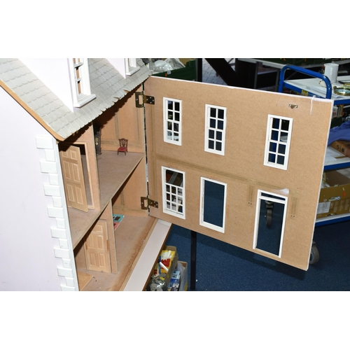 522 - A MODERN WOODEN DOLLS HOUSE, modelled as a two storey villa, front opens to reveal two rooms over tw... 