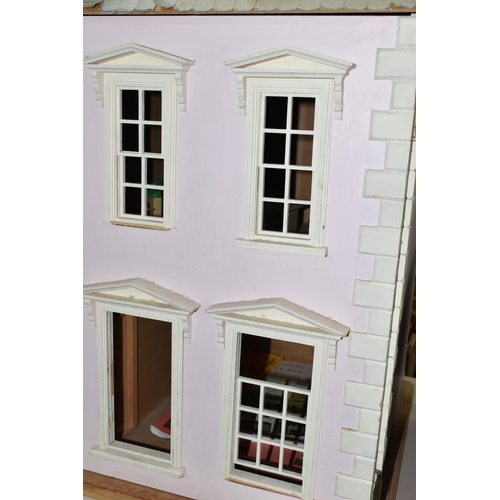 522 - A MODERN WOODEN DOLLS HOUSE, modelled as a two storey villa, front opens to reveal two rooms over tw... 