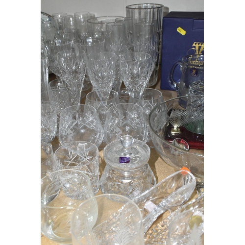 551 - A QUANTITY OF CUT CRYSTAL AND GLASSWARE, comprising a boxed Dartington Crystal vase, two boxed Tutbu... 