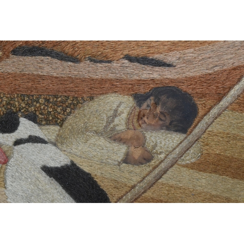 589 - AN EARLY 19TH CENTURY NEEDLEWORK PASTORAL SCENE, depicting two shepherds and their dogs resting in a... 