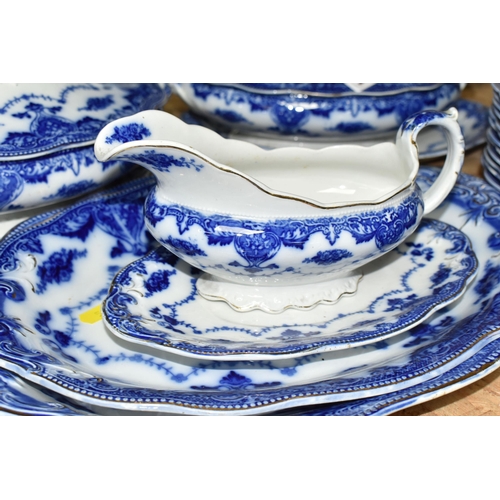 591 - A QUANTITY OF FLOW BLUE WAVERLEY PATTERN BY GRINDLEY DINNERWARE, comprising twelve dinner plates, tw... 