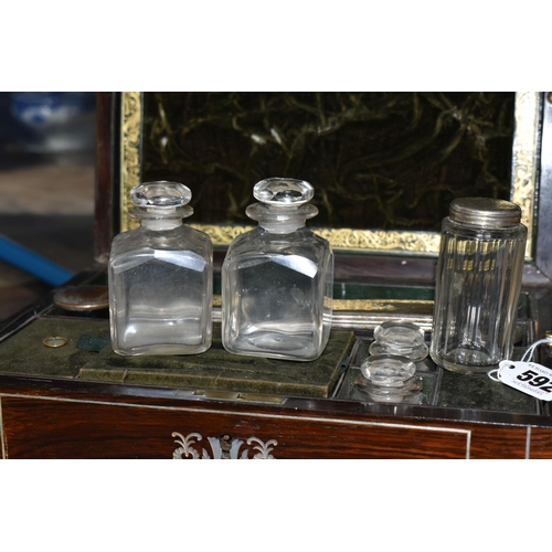 592 - A VICTORIAN MOTHER OF PEARL INLAY VANITY AND JEWELLERY BOX, the fitted interior with silver plate mo... 