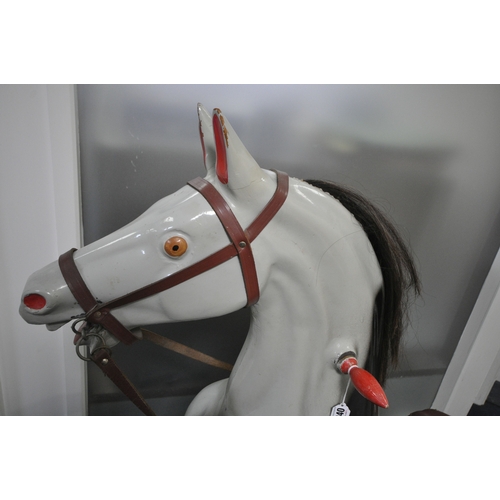 1200 - A RAGAMUFFIN TOYS LTD ROCKING HORSE, the grey and black spotty painted fibreglass leaping horse moun... 