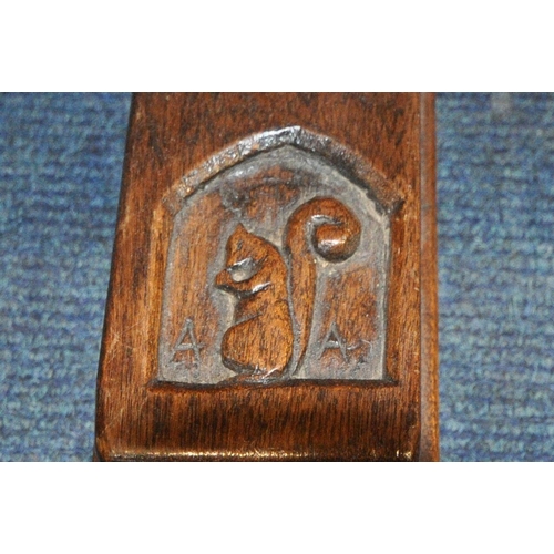 1203 - IN THE MANNER OF WILF 'SQUIRRELMAN' HUTCHINSON, AN OAK REFECTORY TABLE, with adzed surface, raised o... 